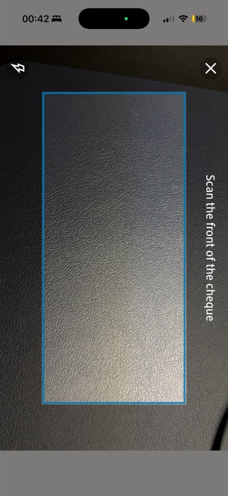 Reskinned scanner in a dim, low-contrast setting, guiding the user to reposition the cheque